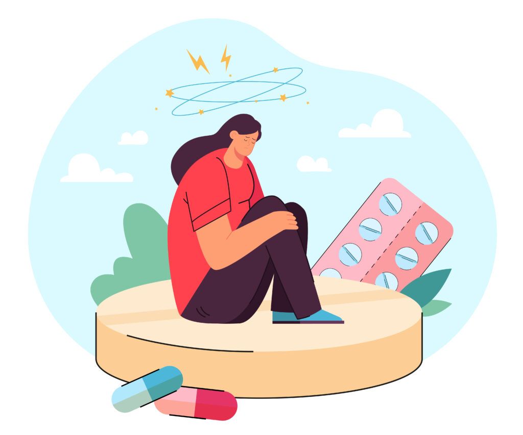Tiny, depressed woman with anxiety sitting on large pill